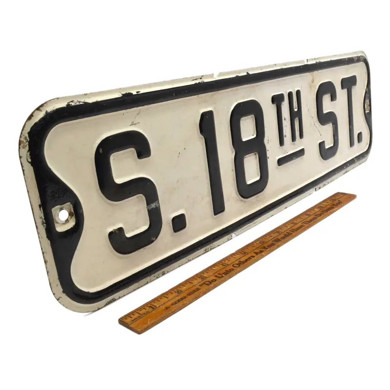 Authentic Pressed Steel Street Sign: ‘S. 18TH ST.’ in Classic Black-on-White Traffic Design