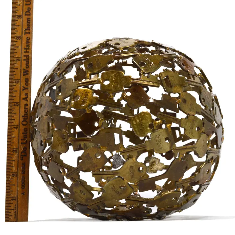 Folk Art Steel Key Globe — 8-Inch Sculptural Sphere with Brass-Finish Detailing