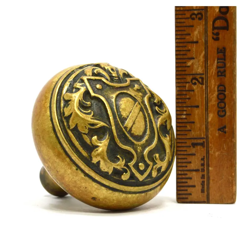 Ornate 19th-Century Brass Door Knob – Salvaged Shield-Motif Hardware Piece